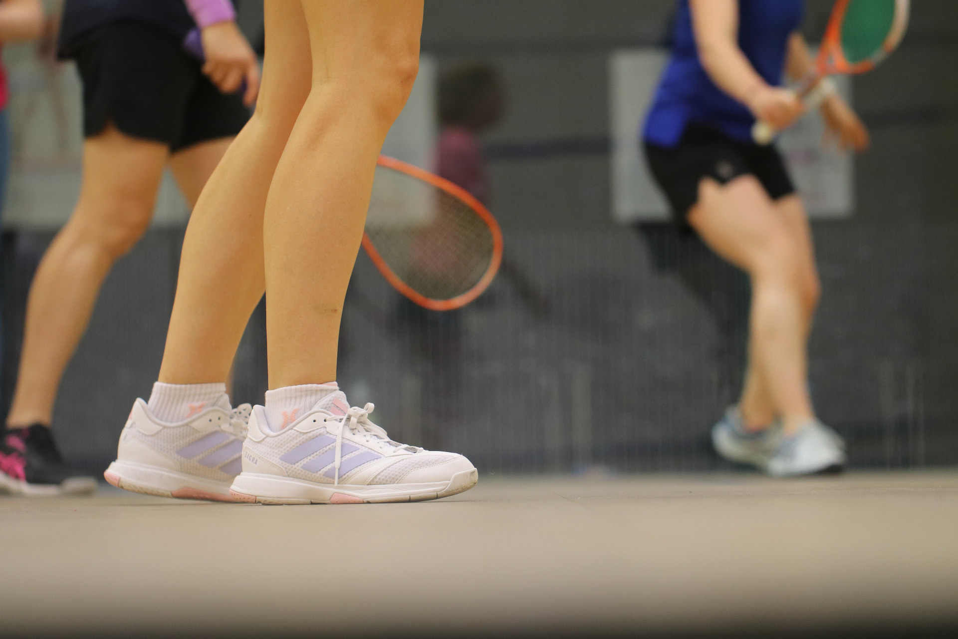 Group of players in a squash coaching session at the National Squash Centre