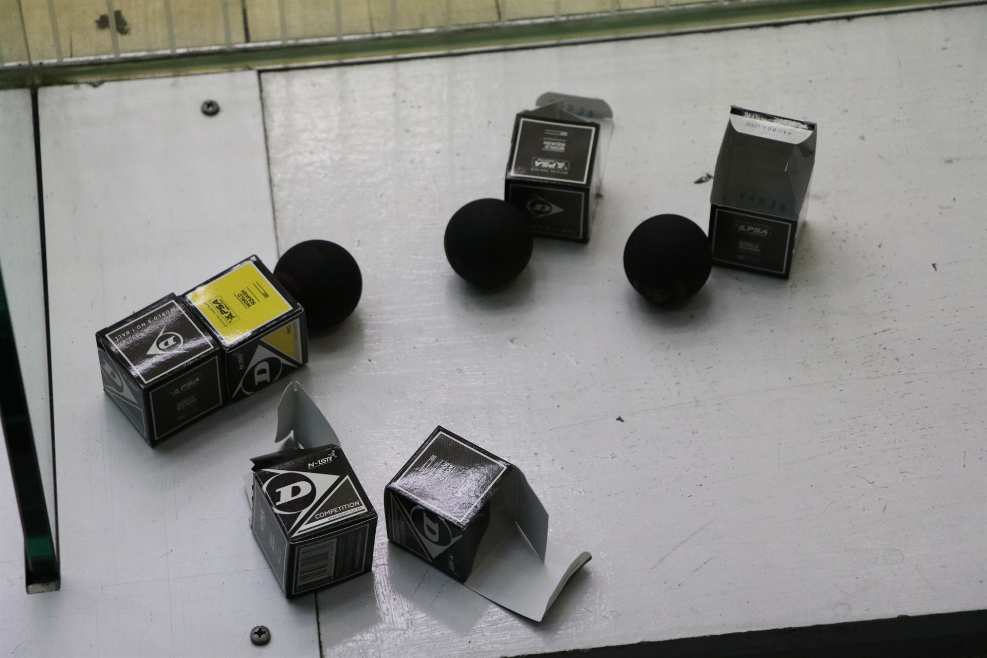 Boxes of squash balls used during group coaching sessions