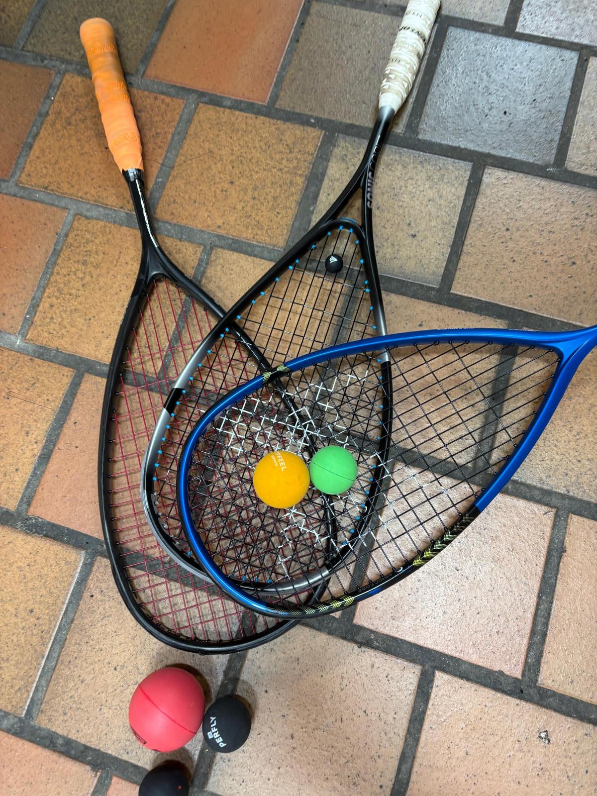 Squash rackets and balls, the kit a coach brings to a first lesson
